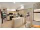 Modern kitchen with L-shaped counters, stainless steel appliances, and a view to the backyard at 10302 E Lotus Ct, Chandler, AZ 85248