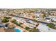 Aerial view showcasing a single-story house with a pool and solar panels at 10517 W Diana Ave, Peoria, AZ 85345