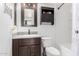 Clean bathroom with dark brown vanity, a large mirror, and a shower/tub combo at 10517 W Diana Ave, Peoria, AZ 85345