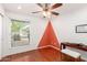 Charming bedroom with hardwood floors and an accent wall at 10517 W Diana Ave, Peoria, AZ 85345