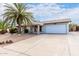 Single story home with a carport and palm tree in the front yard at 10517 W Diana Ave, Peoria, AZ 85345