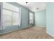 Bedroom with light-teal walls, large windows, and carpet at 11640 N Tatum Blvd # 2079, Phoenix, AZ 85028