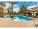 Community pool with lounge chairs and landscaping at 11640 N Tatum Blvd # 2079, Phoenix, AZ 85028