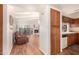 Kitchen with wood cabinets and view into living room at 12017 N 27Th Pl, Phoenix, AZ 85028