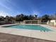 Community pool with adjacent covered seating area at 12017 N 27Th Pl, Phoenix, AZ 85028