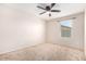 Well-lit bedroom with carpet flooring, ceiling fan and window at 1333 N Balboa --, Mesa, AZ 85205