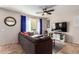 Comfortable living room with large TV, stylish console, and a plush sectional sofa for relaxing at 1333 N Balboa --, Mesa, AZ 85205