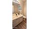 Bathroom with single vanity and shower/tub combo at 13383 W Ironwood St, Surprise, AZ 85374