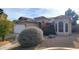 Single-story home with attached two-car garage and landscaped front yard at 13383 W Ironwood St, Surprise, AZ 85374