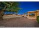 Spacious backyard with gravel landscaping and golf course view at 13708 W Robertson Dr, Sun City West, AZ 85375