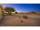 Landscaped backyard with gravel, cactus, and a view of the golf course at 13708 W Robertson Dr, Sun City West, AZ 85375