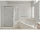 Bathroom with shower and bathtub at 13708 W Robertson Dr, Sun City West, AZ 85375