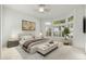 Main bedroom with large window and neutral decor at 13708 W Robertson Dr, Sun City West, AZ 85375