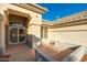 Front entry with decorative security door and tiled flooring at 13708 W Robertson Dr, Sun City West, AZ 85375