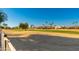 View of a green golf course from a backyard at 13708 W Robertson Dr, Sun City West, AZ 85375