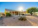 Back exterior view of single story house with covered patio at 13708 W Robertson Dr, Sun City West, AZ 85375