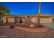 Front view of single story house with desert landscaping at 13708 W Robertson Dr, Sun City West, AZ 85375