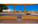 Covered patio overlooks a beautifully landscaped backyard and golf course at 13708 W Robertson Dr, Sun City West, AZ 85375