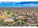 Aerial view of community amenities including clubhouse, pool, and tennis courts at 14328 W Dusty Trail Blvd, Sun City West, AZ 85375