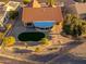 Aerial view of home with pool and landscaped yard at 14328 W Dusty Trail Blvd, Sun City West, AZ 85375