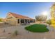 Attractive backyard with putting green and sunroom view at 14328 W Dusty Trail Blvd, Sun City West, AZ 85375