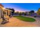 Relaxing backyard with covered patio and putting green at 14328 W Dusty Trail Blvd, Sun City West, AZ 85375