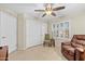 Bright bedroom with a large closet and comfortable seating at 14328 W Dusty Trail Blvd, Sun City West, AZ 85375