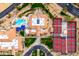 Top-down view of clubhouse, pool, and tennis courts at 14328 W Dusty Trail Blvd, Sun City West, AZ 85375