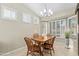 Bright dining area with wood table and window seating at 14328 W Dusty Trail Blvd, Sun City West, AZ 85375