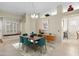 Bright dining area with a built-in window seat and modern table at 14328 W Dusty Trail Blvd, Sun City West, AZ 85375