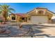 Single-story home with desert landscaping and a two-car garage at 14328 W Dusty Trail Blvd, Sun City West, AZ 85375