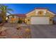 Attractive desert home exterior with a two car garage at 14328 W Dusty Trail Blvd, Sun City West, AZ 85375