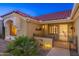 Front entrance with an ornate gate and walkway lighting at 14328 W Dusty Trail Blvd, Sun City West, AZ 85375