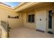 Inviting entryway with a decorative metal door and courtyard at 14328 W Dusty Trail Blvd, Sun City West, AZ 85375