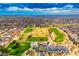 Aerial view of a lush green golf course with club house at 14328 W Dusty Trail Blvd, Sun City West, AZ 85375