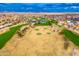 Aerial view of a golf course with fairways and greens at 14328 W Dusty Trail Blvd, Sun City West, AZ 85375