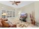 Relaxing living room with a large TV and comfortable seating at 14328 W Dusty Trail Blvd, Sun City West, AZ 85375