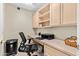 Home office with built-in desk and shelving at 14328 W Dusty Trail Blvd, Sun City West, AZ 85375