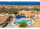 Resort-style pool and spa with surrounding lounge chairs and landscaping at 14328 W Dusty Trail Blvd, Sun City West, AZ 85375