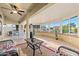 Bright sunroom with table and chairs, offering backyard access at 14328 W Dusty Trail Blvd, Sun City West, AZ 85375