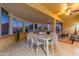 Bright sunroom with a dining table and comfortable seating at 14328 W Dusty Trail Blvd, Sun City West, AZ 85375