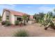 Desert landscaping with a patio, cacti, and gravel at 14414 W Wagon Wheel Dr, Sun City West, AZ 85375