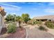 Landscaped backyard with gravel and desert plants at 14414 W Wagon Wheel Dr, Sun City West, AZ 85375