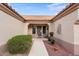 Front entry with security door, decorative metalwork and potted plants at 14414 W Wagon Wheel Dr, Sun City West, AZ 85375