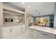 Kitchen with island and ample counter space. Open to dining and living areas at 14414 W Wagon Wheel Dr, Sun City West, AZ 85375