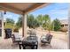 Relaxing covered patio with seating area and desert views at 14414 W Wagon Wheel Dr, Sun City West, AZ 85375