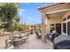 Covered patio with seating area, a grill, and views of the desert landscape at 14414 W Wagon Wheel Dr, Sun City West, AZ 85375