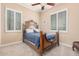 Cozy guest bedroom with a comfortable bed and window shutters at 1534 E Sweet Citrus Dr, Queen Creek, AZ 85140