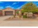 Single-story home with two-car garage and desert landscaping at 1534 E Sweet Citrus Dr, Queen Creek, AZ 85140