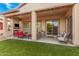 Relaxing patio with seating area and fireplace at 1534 E Sweet Citrus Dr, Queen Creek, AZ 85140